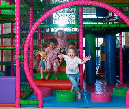 Children playing in a DL Kids soft play area.