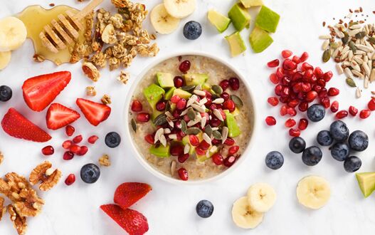 Healthy fruit and grains making up a freshly prepared breakfast bowl